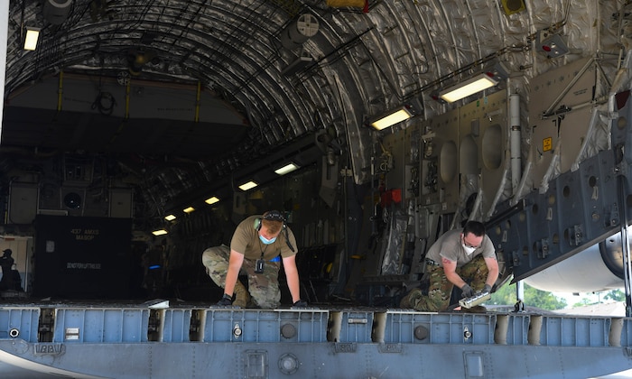 Airmen prepare a Joint Base Charleston C-17 Globemaster III for launch July 31st, 2020 at the JB Charleston flightline, S.C. C-17s from JB Charleston are a part of the NASA human space flight program. As a precautionary measure, U.S. Space Command and the U.S. Air Force assigned teams of search and rescue professionals to stand alert ahead of the launch at Joint Base Charleston, South Carolina; Patrick Air Force Base, Florida; and Joint Base Pearl Harbor-Hickam, Hawaii. The teams are comprised of Pararescuemen, Combat Rescue Officers, and Aircrew Flight Equipment specialists.