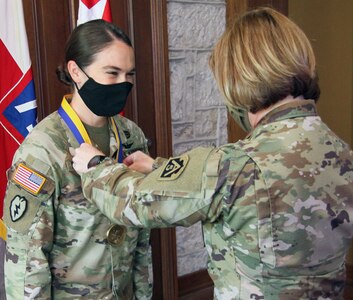 Lt. Gen. Laura J. Richardson (right), U.S. Army North Commanding General,presents Chief Warrant Officer 4 Laura Ingraham, an aviation safety officer assigned to U.S. Army North, with the honorable Order of St. Michael bronze medal at Joint Base San Antonio-Fort Sam Houston Aug. 4. The Order of St. Michael is an Army Aviation Association of America award presented to nominated Army aviators who make a significant contribution to their field and highly demonstrate the Army Values.