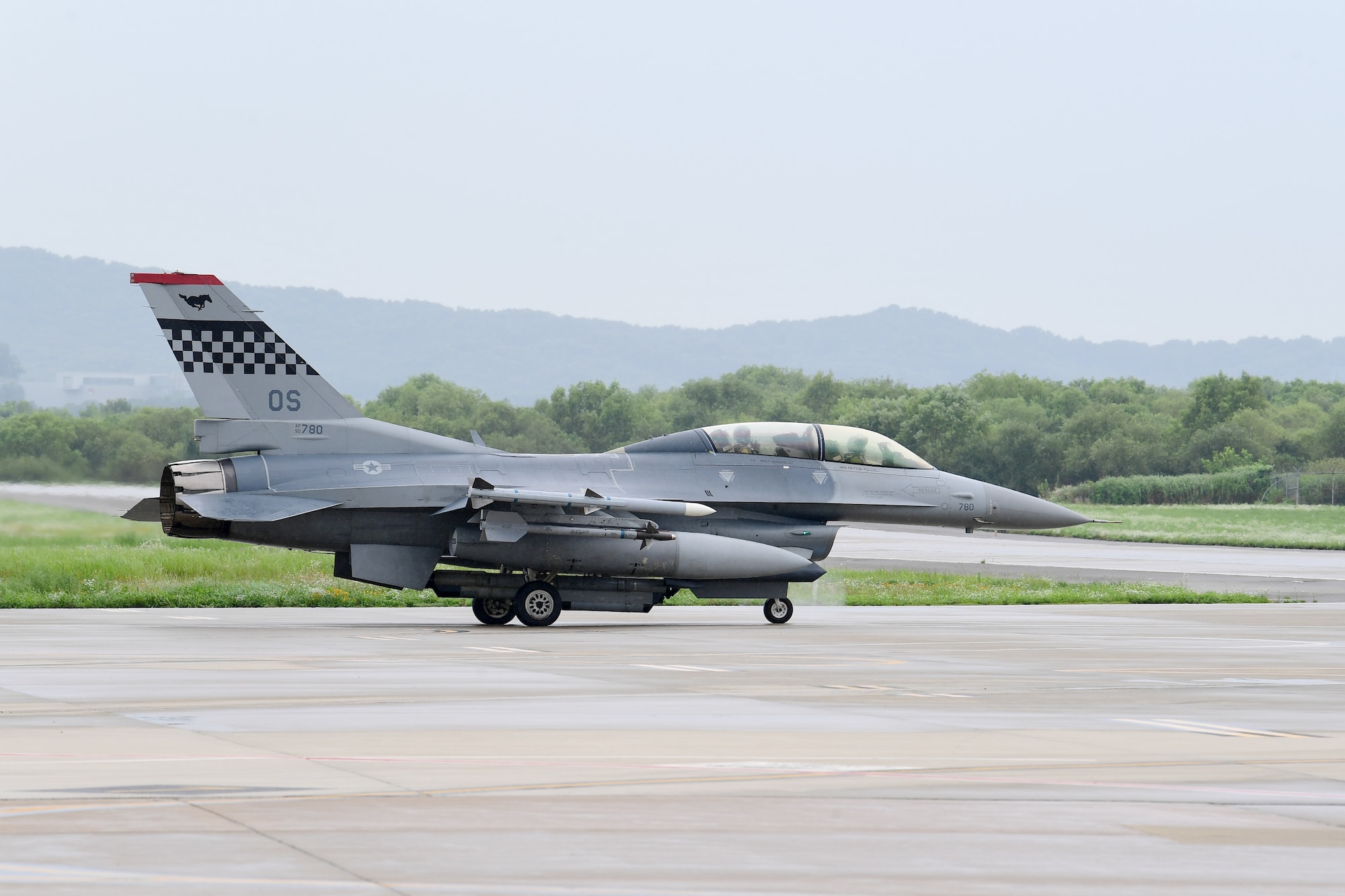 Capt. Louis Bloom, 36th Fighter Squadron F-16 pilot, left, and Maj. Chris Ng, 51st Medical Operations Squadron general surgeon, taxi out to the runway at Osan Air Base, Republic of Korea, July 28, 2020.  Both hailing from Randolph, Massachusetts, the Randolph High School graduates continued their friendship while attending the United States Air Force Academy. Rekindling at Osan Air Base, their familiarization flight plans were initially derailed due to Bloom’s motorcycle accident. Ng’s medical expertise was instrumental to Bloom’s full and speedy recovery during the surgical and rehabilitation process, ultimately resulting in finally flying together. (U.S. Air Force photo by Senior Airman Noah Sudolcan)