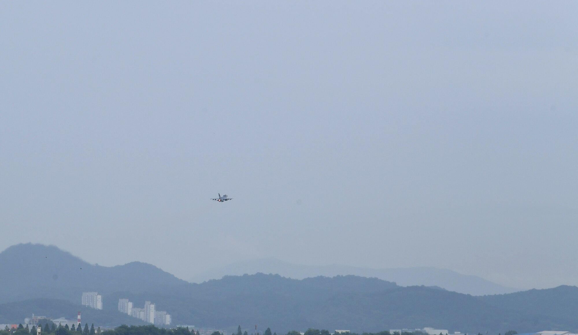 Capt. Louis Bloom, 36th Fighter Squadron F-16 pilot, left, and Maj. Chris Ng, 51st Medical Operations Squadron general surgeon, take off in an F-16 at Osan Air Base, Republic of Korea, July 28, 2020. Both hailing from Randolph, Massachusetts, the Randolph High School graduates continued their friendship while attending the United States Air Force Academy. Rekindling at Osan Air Base, their familiarization flight plans were initially derailed due to Bloom’s motorcycle accident. Ng’s medical expertise was instrumental to Bloom’s full and speedy recovery during the surgical and rehabilitation process, ultimately resulting in finally flying together. (U.S. Air Force photo by Senior Airman Noah Sudolcan)