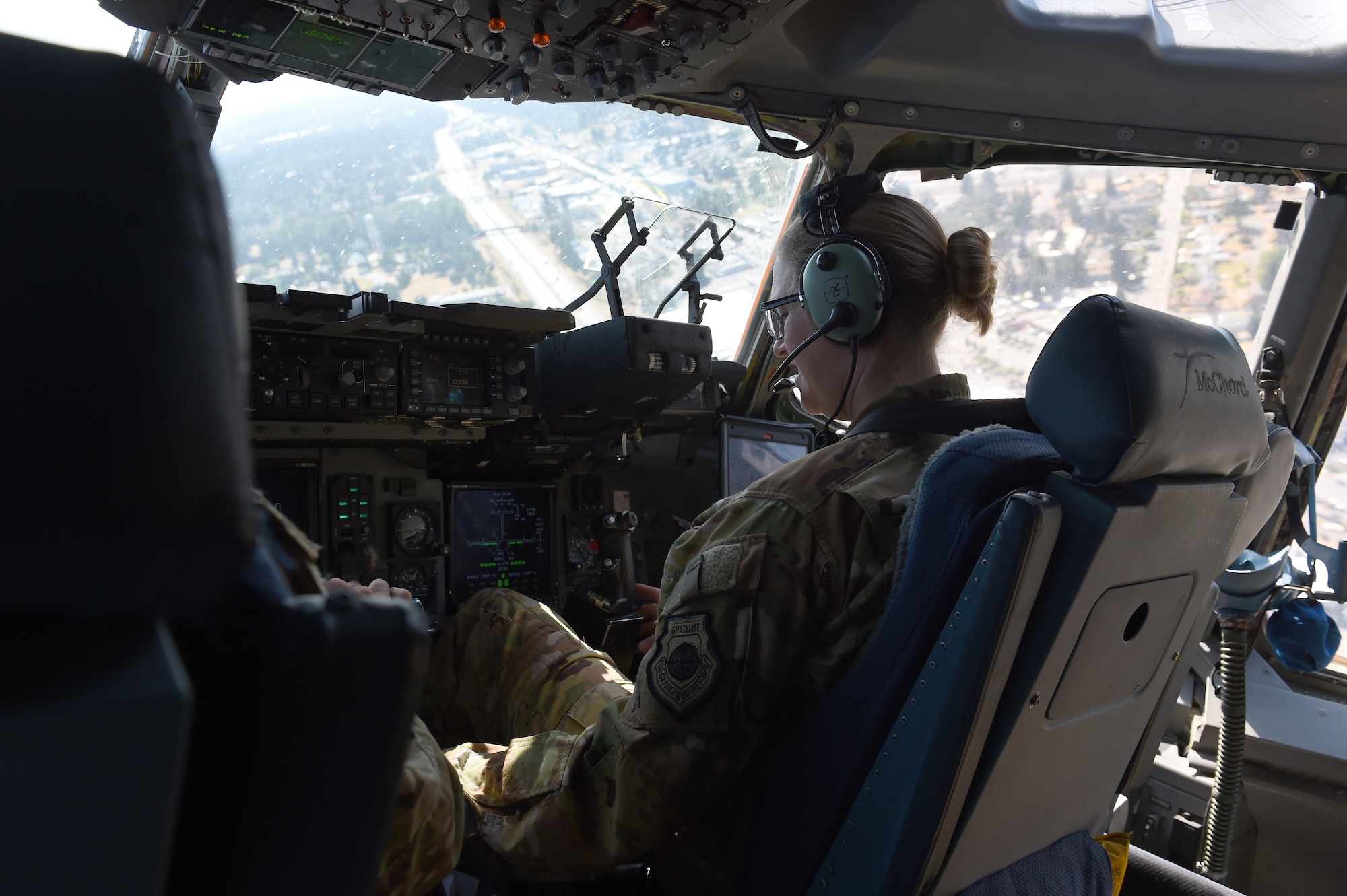 Col. Erin Staine-Pyne, 62nd Airlift Wing commander, prepares to land a C-17 Globemaster III on the McChord flight line, on Joint Base Lewis-McChord, Wash., Aug. 4, 2020. Training exercises such as Exercise Rainier War, allow opportunities for pilots to practice flight skills and log flight hours. (U.S. Air Force photo by Airman 1st Class Mikayla Heineck)