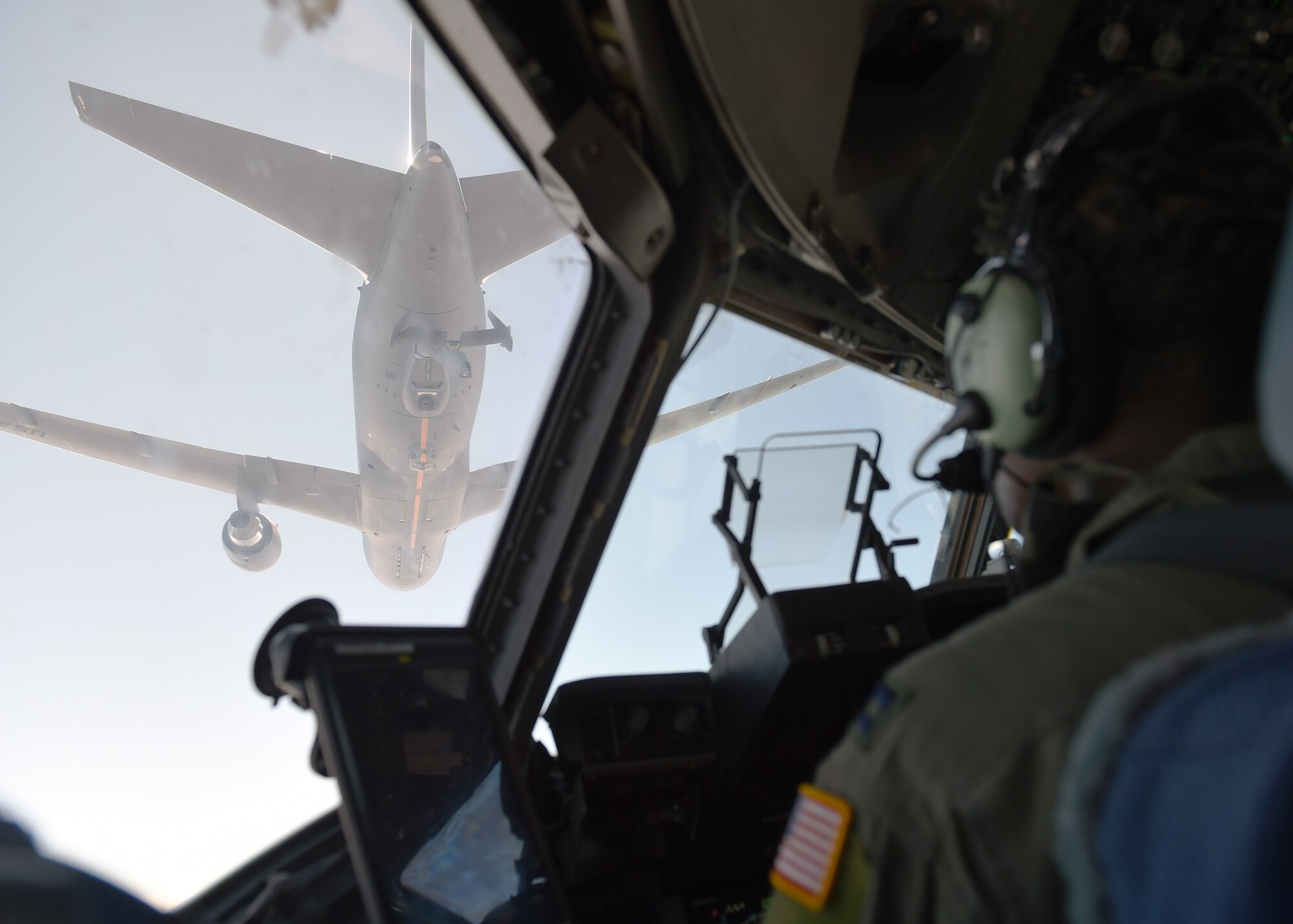 Capt. Edmond Duvall, 7th Airlift Squadron pilot, prepares to aerial refuel a C-17 Globemaster III from a KC-46 Pegasus from Fairchild Air Force Base, Wash., over Washington, Aug. 5, 2020. The KC-46 Pegasus is the Air Force’s newest refueling aircraft and many pilots are still learning and being certified on how to conduct refueling.  (U.S. Air Force photo by Airman 1st Class Mikayla Heineck)