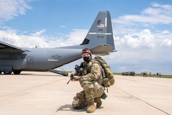 Airman with gun defending the aircraft area