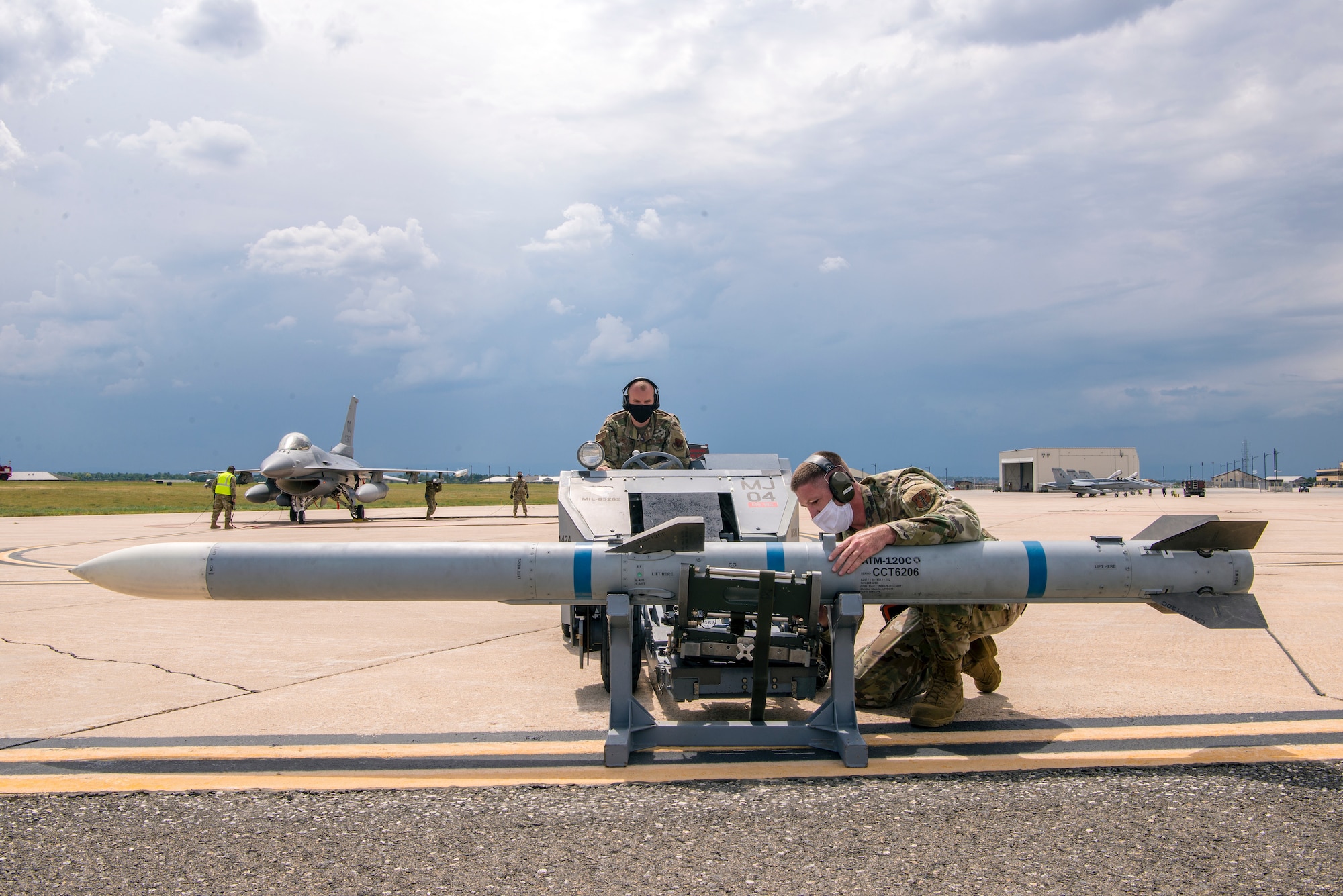 Two Airmen with a jammer and missile