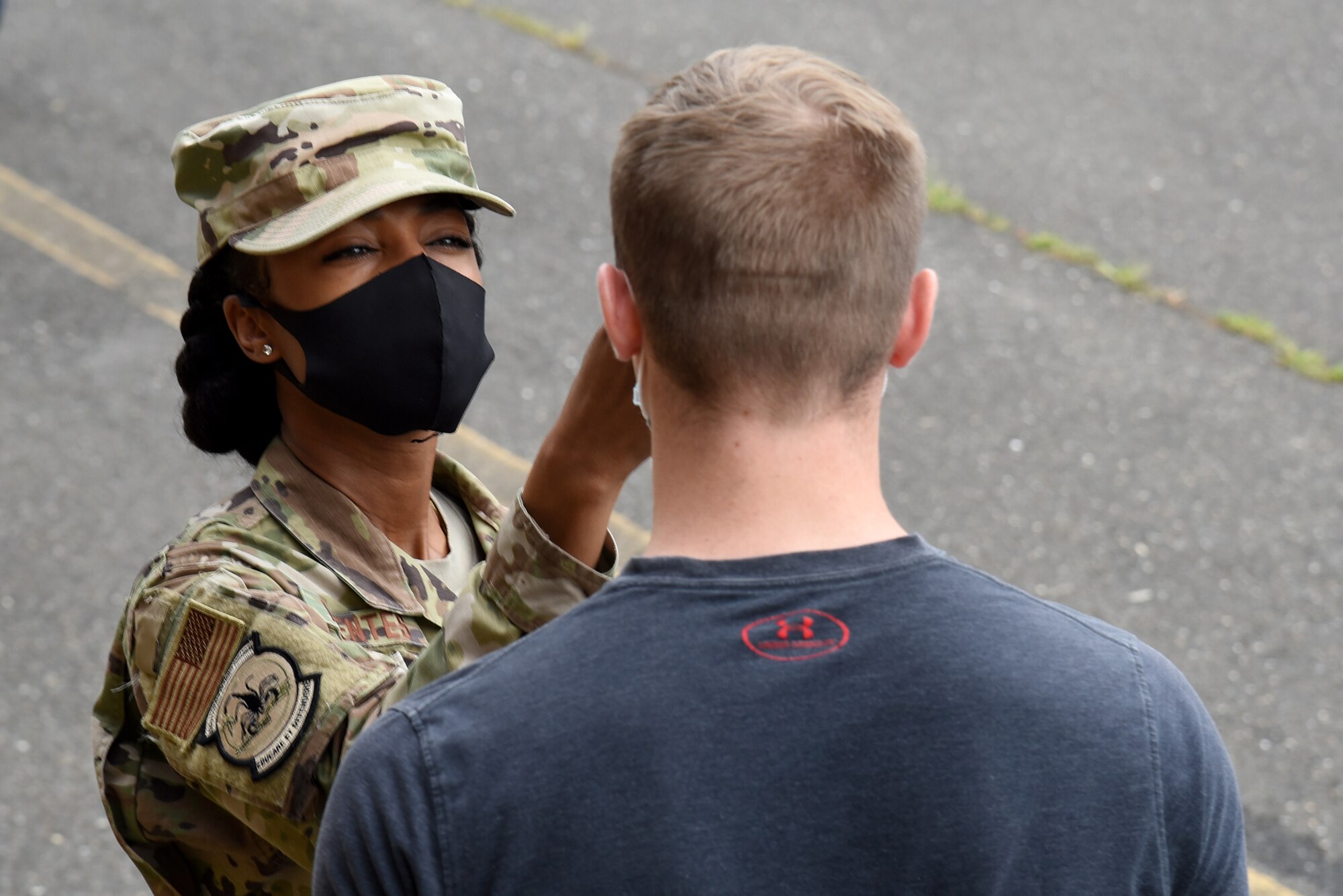 Photo of Airman conducting temperature checks