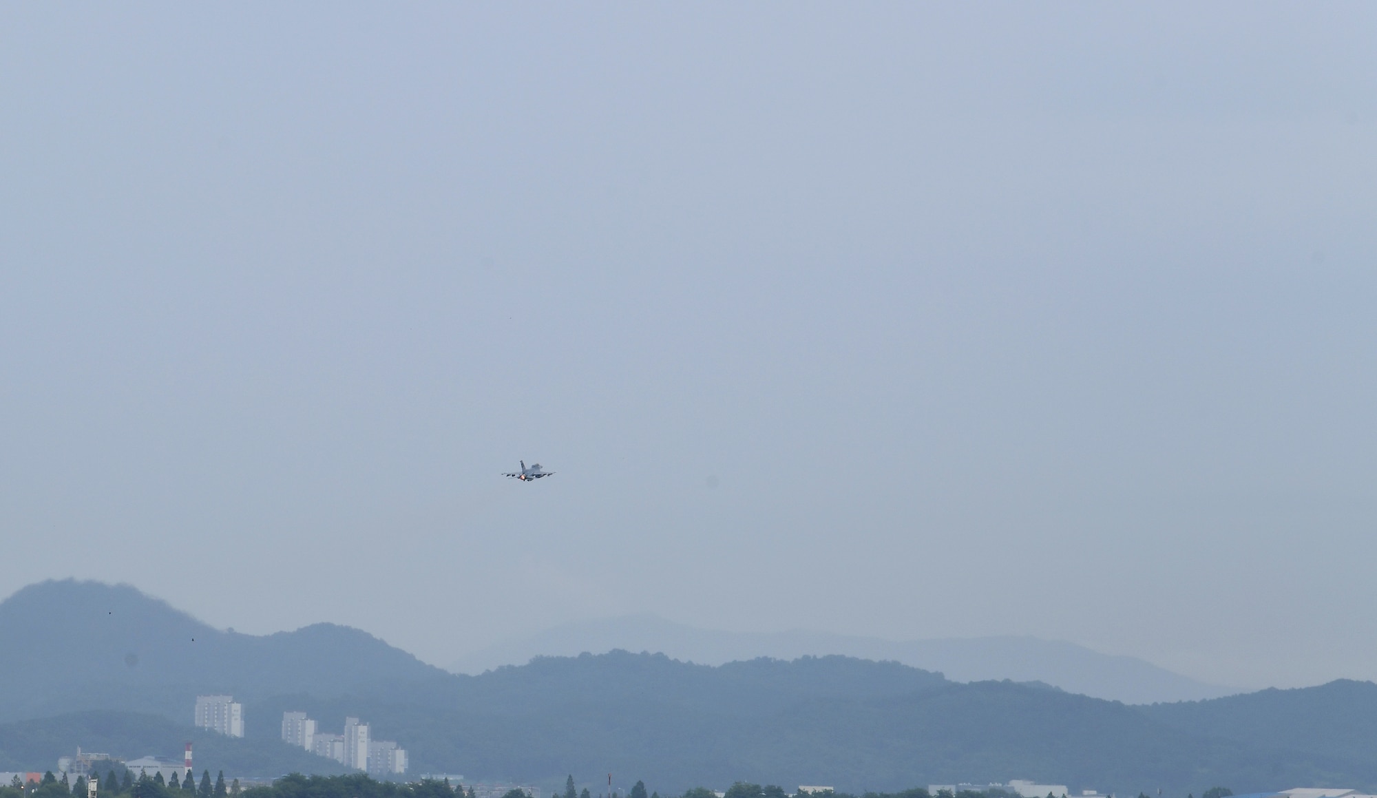 Capt. Louis Bloom, 36th Fighter Squadron F-16 pilot, left, and Maj. Chris Ng, 51st Medical Operations Squadron general surgeon, take off in an F-16 at Osan Air Base, Republic of Korea, July 28, 2020. Both hailing from Randolph, Massachusetts, the Randolph High School graduates continued their friendship while attending the United States Air Force Academy. Rekindling at Osan Air Base, their familiarization flight plans were initially derailed due to Bloom’s motorcycle accident. Ng’s medical expertise was instrumental to Bloom’s full and speedy recovery during the surgical and rehabilitation process, ultimately resulting in finally flying together. (U.S. Air Force photo by Senior Airman Noah Sudolcan)