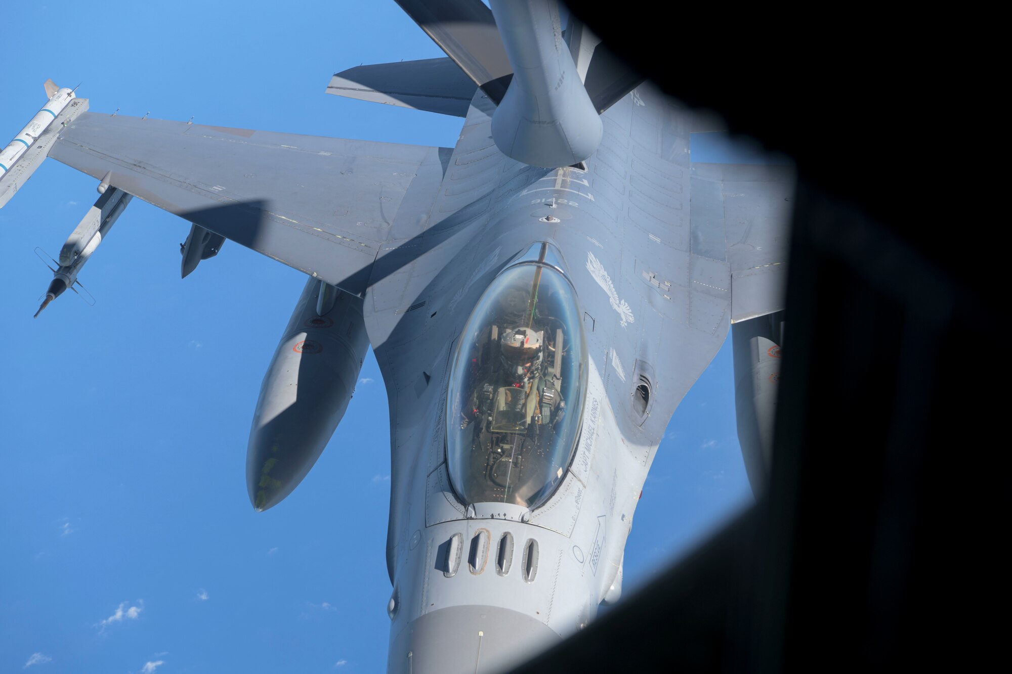 U.S. Air Force F-16 Fighting Falcon from the 35th Fighter Wing, Misawa Air Base, Japan, is being refueled by a KC-135 Stratotanker from the 909th Air Refueling Squadron during the second iteration of Exercise WestPac Rumrunner, July 31, 2020, at Kadena Air Base, Japan. The National Defense Strategy (NDS) directs the U.S. military to be more lethal, improve relationships with allies and partners, and encourage institutional reform; the 18th Wing supports the NDS by developing and continuing new training exercises like WestPac Rumrunner.