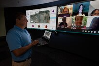 Naval Information Warfare Center (NIWC) Atlantic scientist, Todd Remmel shows his students how the data they collected during a week long class and can be used in geographic information systems.