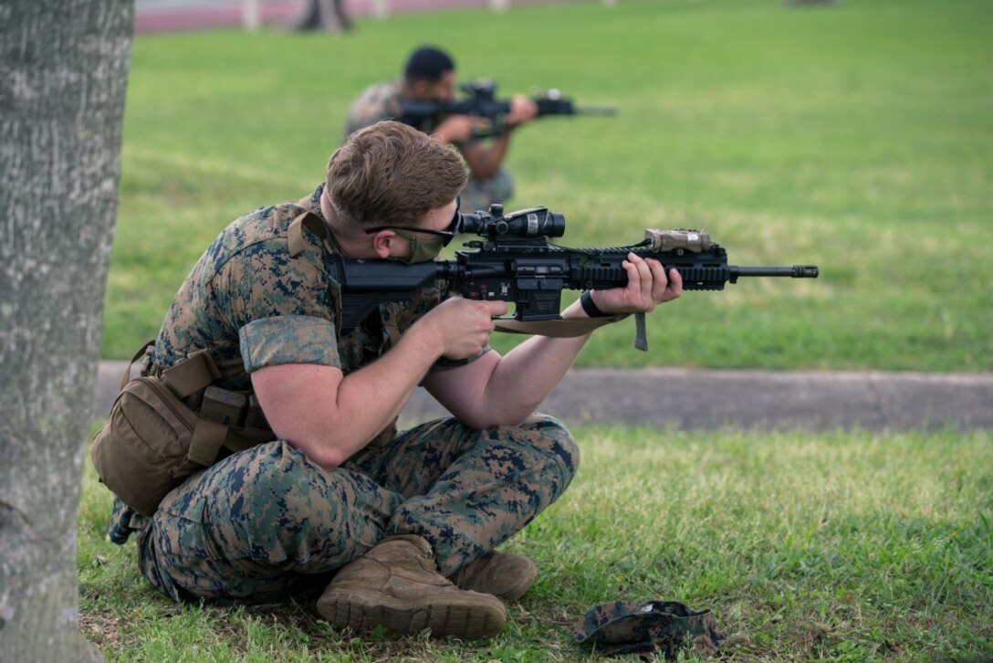 Lance Cpl. Darrek Proctor, a machine gunner with Charlie Company, Battalion Landing Team, 1st Battalion, 5th Marines, 31st Marine Expeditionary Unit (MEU), practices marksmanship fundamentals from the seated position on Camp Hansen, Okinawa, Japan, May 7, 2020. The 31st MEU, the Marine Corps' only continuously forward-deployed MEU, provides a flexible and lethal force ready to perform a wide range of military operations as the premier crisis response force in the Indo-Pacific region. (Official U.S. Marine Corps photo by Lance Cpl. Andrew R. Bray)