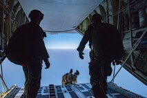 A Force Reconnaissance Marine with the 31st Marine Expeditionary Unit’s (MEU) Maritime Raid Force dives out of a KC-130J Hercules with Marine Aerial Refueler Transport Squadron 152, during free fall training at le Jima, Okinawa, Japan, July 30, 2020. The 31st MEU, the Marine Corps’ only continuously forward-deployed MEU, provides a flexible and lethal force ready to perform a wide range of military operations as the premier crisis response force in the Indo-Pacific region. The 31st MEU has implemented strict health protection measures and will continue to conduct mission essential training in support of regional security and stability. (U.S. Marine Corps Photo by Lance Cpl. Joshua Brittenham)