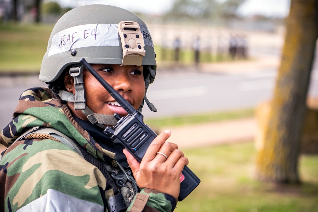 U.S. Air Force Senior Airman Gabrielle Winn, 501st Combat Support Wing broadcast journalist, conducts a radio check during a wing readiness exercise at RAF Alconbury, England, Aug. 5, 2020. The 501st Combat Support Wing conducted the exercise to evaluate Airmen’s overall readiness along with their proficiency with responding to simulated chemical, biological, radiological, nuclear and explosive attacks. (U.S. Air Force photo by Senior Airman Eugene Oliver)