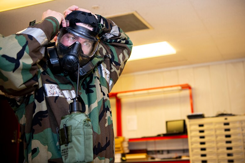 U.S. Air Force Staff Sgt. Scott Sorenson, 423rd Communications Squadron noncommissioned officer in charge of network management, adjusts his gas mask during a wing readiness exercise at RAF Alconbury, England, Aug. 5, 2020. The 501st Combat Support Wing conducted the exercise to evaluate Airmen’s overall readiness along with their proficiency with responding to simulated chemical, biological, radiological, nuclear and explosive attacks. (U.S. Air Force photo by Senior Airman Eugene Oliver)