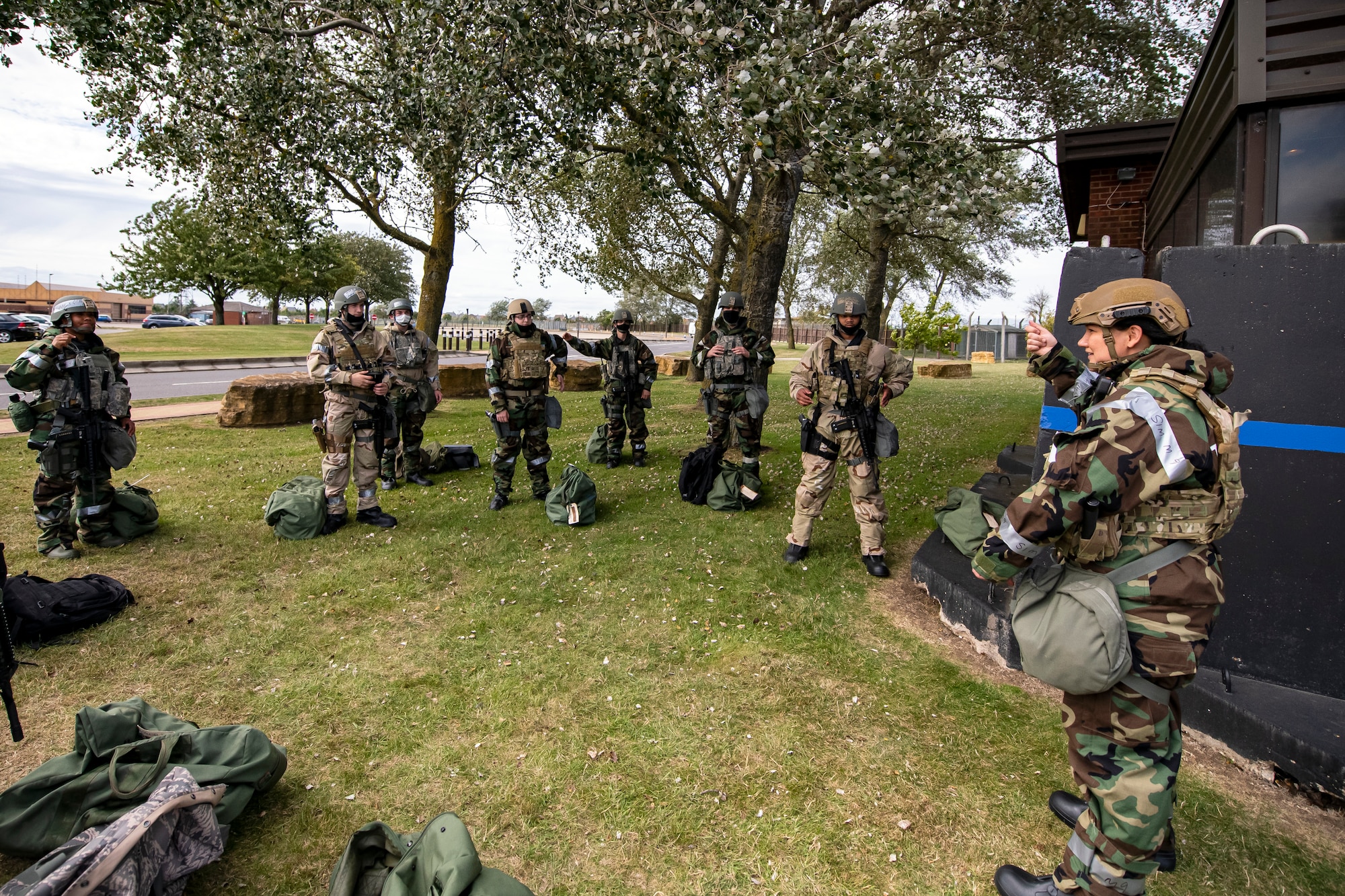 U.S. Air Force Master Sgt. Suzanna Donkor, 423rd Security Forces flight chief, briefs Airmen from the 501st Combat Support Wing (CSW) during a wing readiness exercise at RAF Alconbury, England, Aug. 5, 2020. The 501st CSW conducted the exercise to evaluate Airmen’s overall readiness along with their proficiency with responding to simulated chemical, biological, radiological, nuclear and explosive attacks. (U.S. Air Force photo by Senior Airman Eugene Oliver)