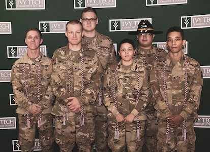 Indiana National Guard Soldiers graduate from the Ivy Tech Community College Cyber Academy Aug. 2, 2019. Front Row: Sgt. Stephen Carlile, 76th Infantry Brigade Combat Team; Spc. James Gill, 2/150 Field Artillery; Spc. Sophia Balderas, 76th Brigade Engineer Battalion; Spc. Caleb Murphy, 151 Heavy Infantry, D Co. Back Row: Spc. Nathaniel Musick, 219th Engineering Brigade; Cpl. Luis Diaz-Sanchez, 1/152 Cav.