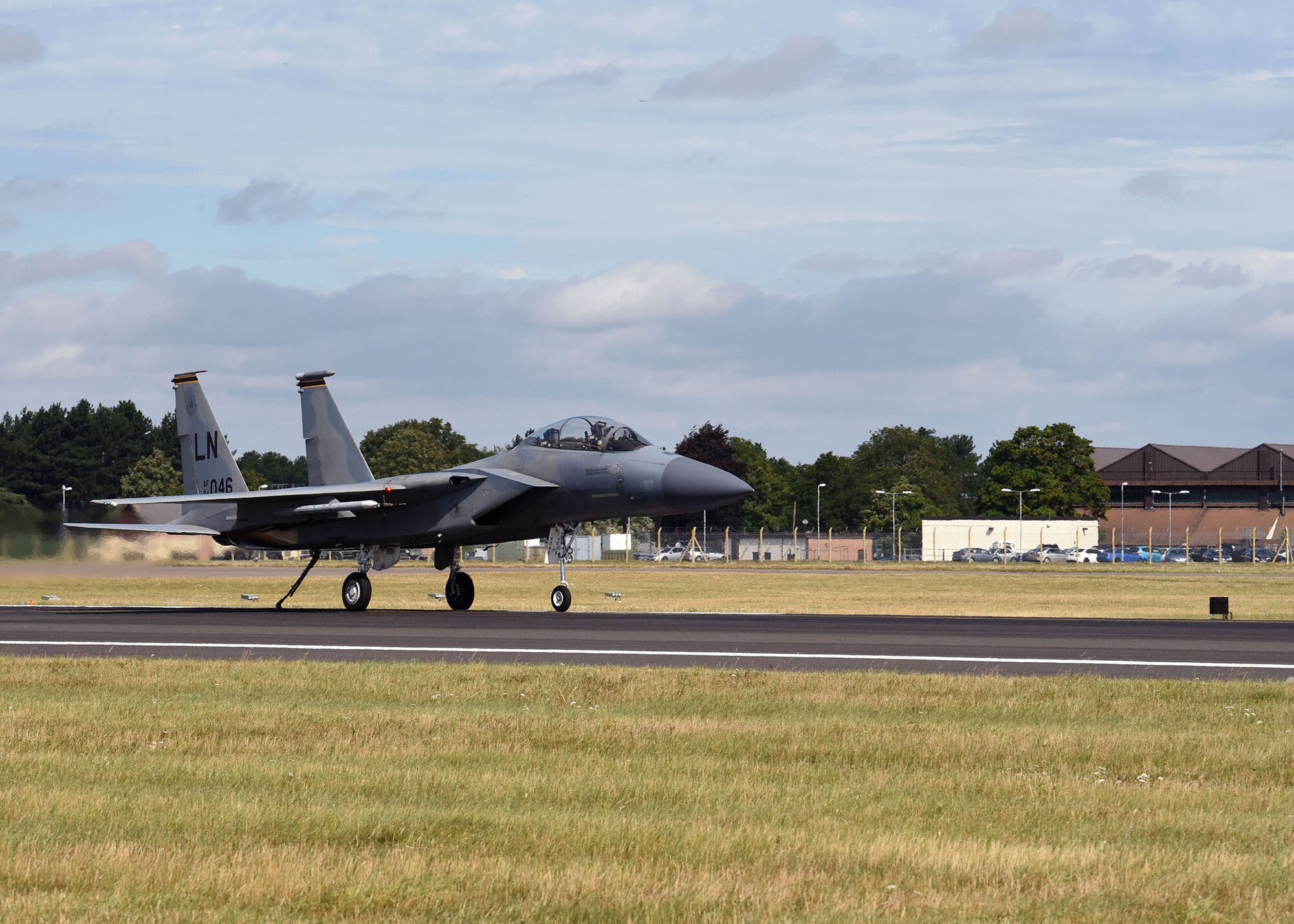 An F-15E Strike Eagle assigned to the 48th Fighter Wing, RAF Lakenheath, taxis during a certification test of the Mobile Aircraft Arresting System at RAF Mildenhall, England, Aug. 5, 2020. Airmen from the 100th Civil Engineer Squadron Power Production shop perform maintenance checks on the barrier cable 365-days-a-year. The cable can take a maximum weight of 40,000 pounds with an aircraft travelling at up to 180 knots. (U.S. Air Force photo by Karen Abeyasekere)