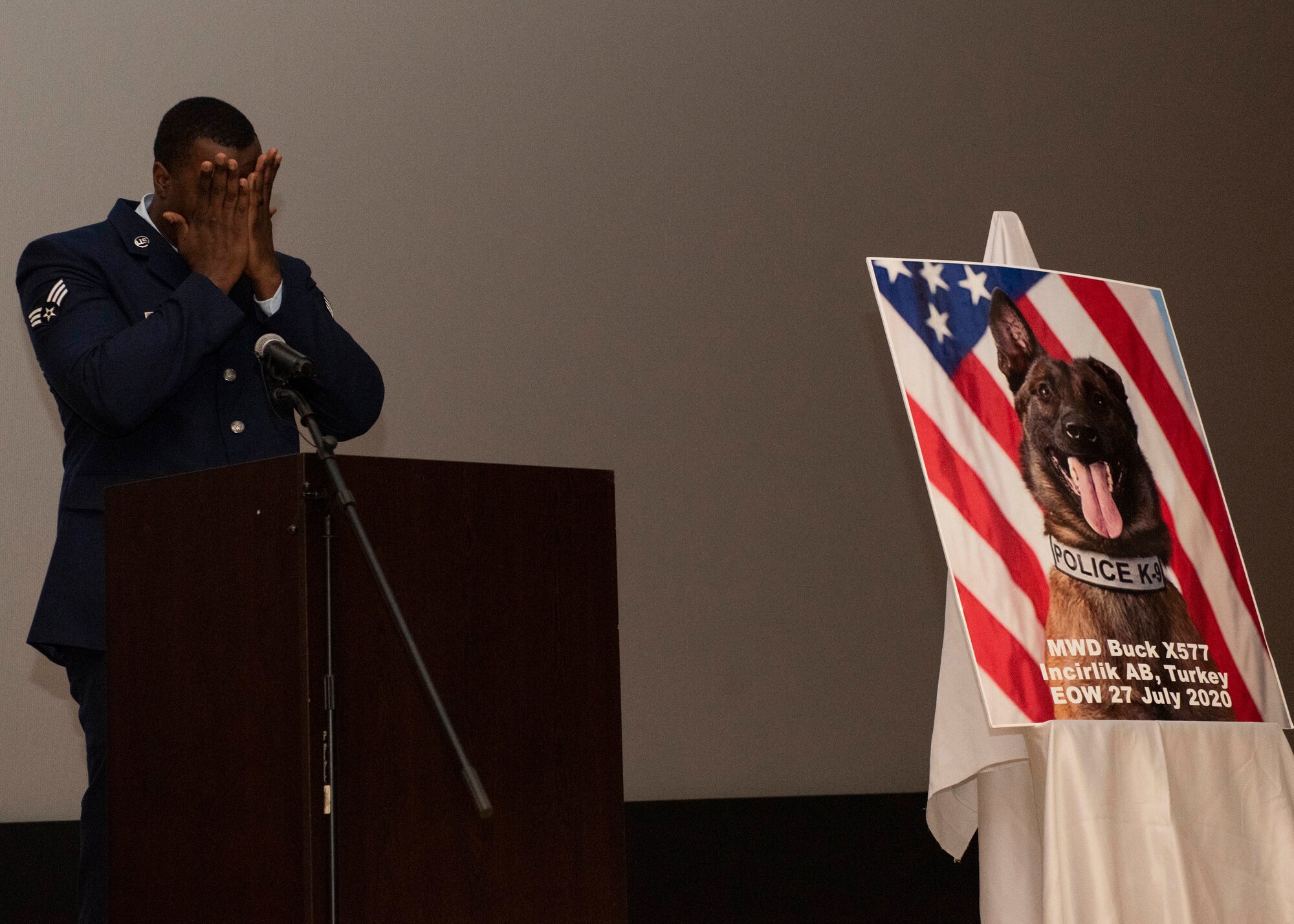 U.S. Senior Airman Antoine Carr, 39th Security Forces Squadron military working dog handler, wipe tears away while at a memorial ceremony, Aug. 5, 2020, at Incirlik Air Base, Turkey