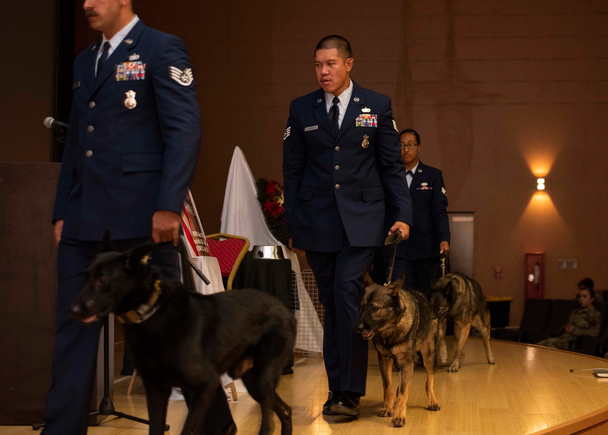 39th Security Forces Squadron military working dog handlers file off stage at the conclusion of a memorial ceremony for MWD Buck, Aug. 5, 2020, Incirlik Air Base, Turkey.