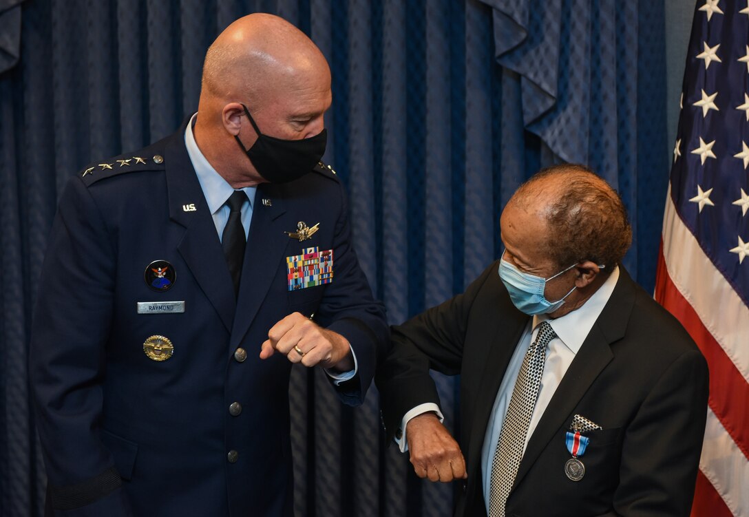 Gen. Jay Raymond, Space Force chief of space operations, congratulates Edward Dwight, sculptor and space pioneer, Aug. 5, 2020, at the Pentagon, Arlington, Virginia. Raymond awarded Dwight the Commander’s Public Service Award and inducted him as an honorary member of the Space Force during his visit. (U.S. Air Force photo by TSgt. Armando A. Schwier-Morales)