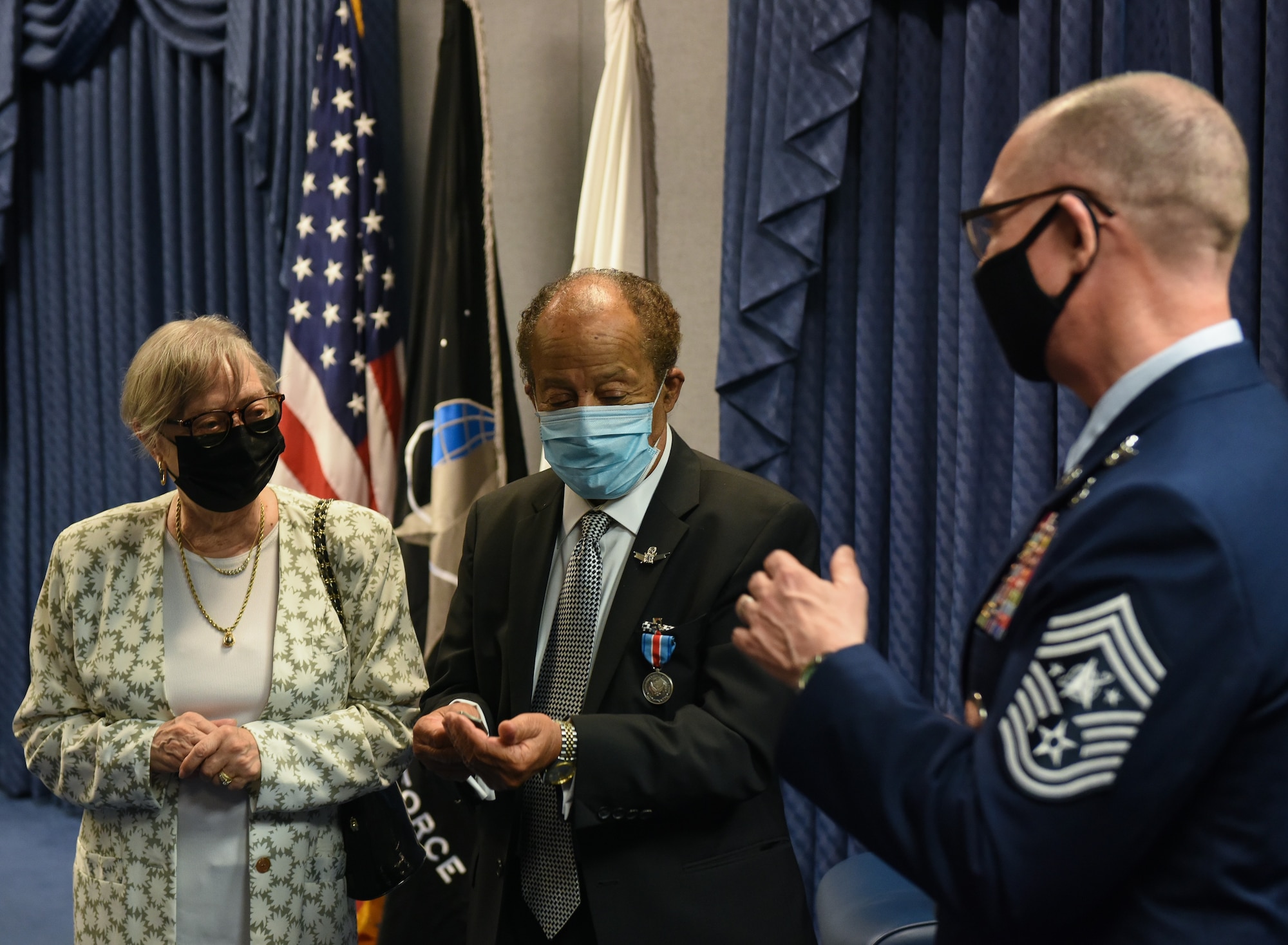 Chief Master Sgt. Roger Towberman, Space Force senior enlisted advisor, presents Edward Dwight, sculptor and space pioneer, with a coin, at the Pentagon, Arlington, Virginia. Dwight became the first honorary member of the Space Force during his visit. (U.S. Air Force photo by TSgt. Armando A. Schwier-Morales)