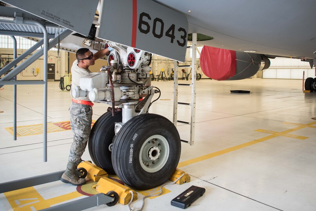 Senior Airman Cuong Nguyen, 931st Maintenance Squadron crew chief, performs a 4A-check inspection on a KC-46A Pegasus Aug. 3, 2020, at McConnell Air Force Base, Kansas. Nguyen and his team are responsible for lubricating 447 connection points on the KC-46 every six months. (U.S. Air Force photo by Senior Airman Alexi Bosarge)