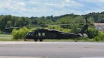 Pennsylvania National Guard Staff Sgt. Noah McElory looks out the window of the UH-60 Black Hawk containing the Pennsylvania Helicopter Aquatic Rescue Team as it takes off from Muir Army Airfield, Fort Indiantown Gap, Pa., Aug. 4, 2020. The team saved two motorists from rising flood waters during Tropical Storm Isaias.