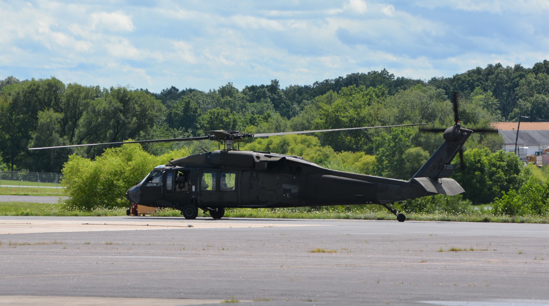Pennsylvania National Guard Staff Sgt. Noah McElory looks out the window of the UH-60 Black Hawk containing the Pennsylvania Helicopter Aquatic Rescue Team as it takes off from Muir Army Airfield, Fort Indiantown Gap, Pa., Aug. 4, 2020. The team saved two motorists from rising flood waters during Tropical Storm Isaias.