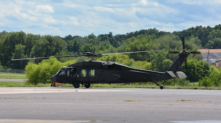 Pennsylvania National Guard Staff Sgt. Noah McElory looks out the window of the UH-60 Black Hawk containing the Pennsylvania Helicopter Aquatic Rescue Team as it takes off from Muir Army Airfield, Fort Indiantown Gap, Pa., Aug. 4, 2020. The team saved two motorists from rising flood waters during Tropical Storm Isaias.