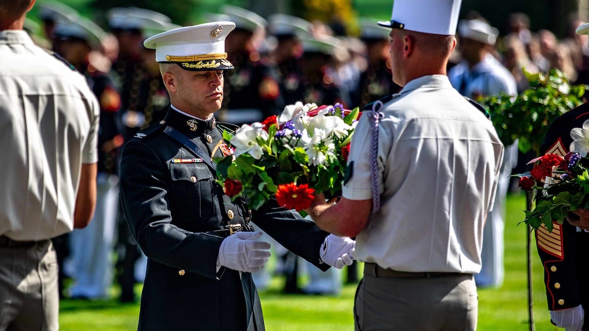 U.S. Marine Corps Col. George C. Schreffler III, commanding officer of 5th Marine Regiment, 1st Marine Division, receives a wreath during a ceremony at the Aisne-Marne Memorial near Belleau, France, May 26, 2019.