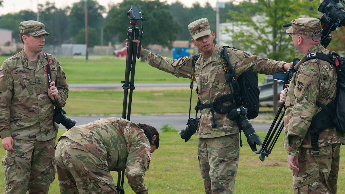 U.S. Army Reserve Public Affairs Soldiers set up camera tripods and work together to create a coverage plan for the Task Force 46S end-of-course validation exercise at Fort McCoy, Wisconsin, July 20, 2019.