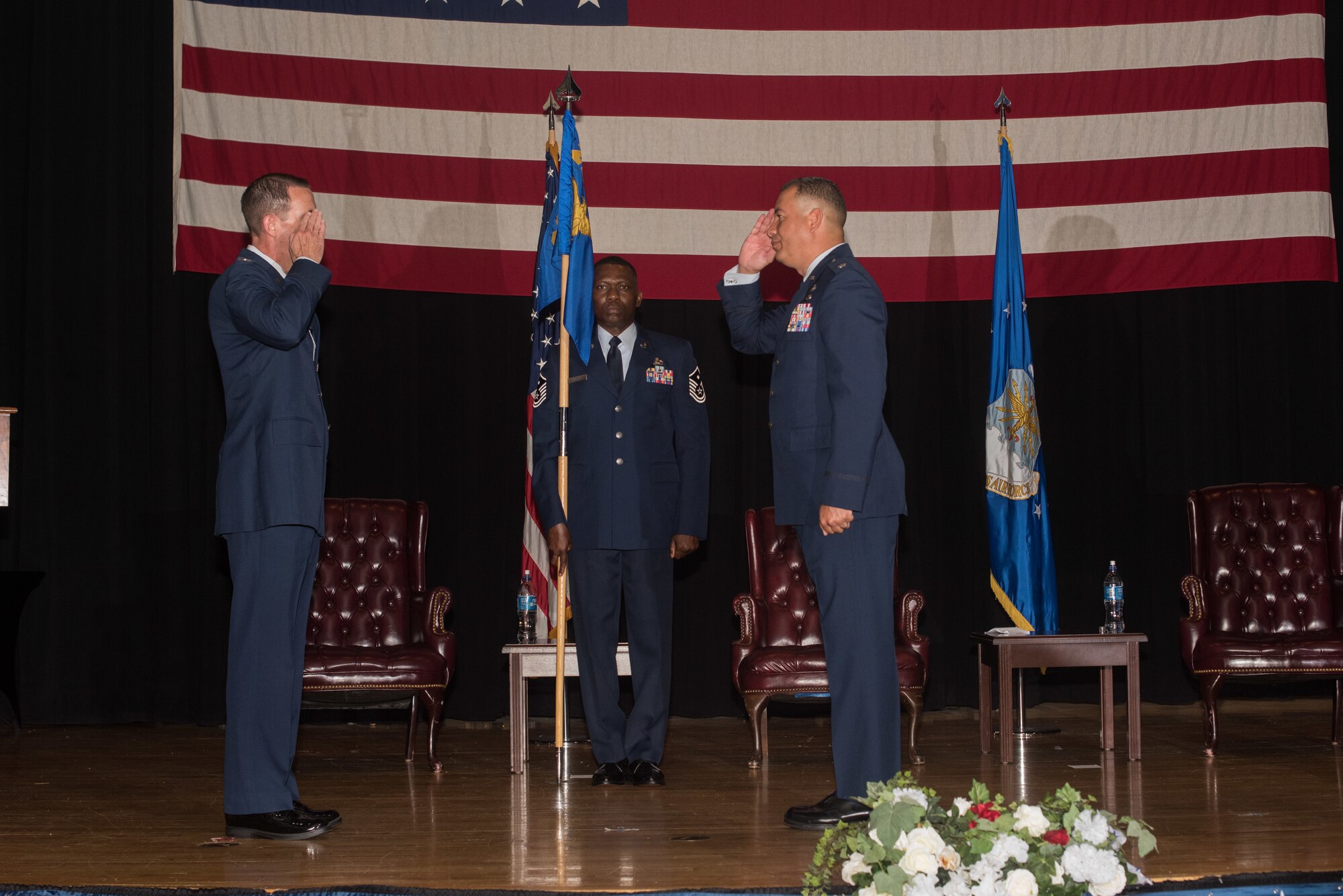 Lt. Col. Carlos Colon, 22nd Force Support Squadron outgoing commander, right, relinquishes command during a change of command ceremony Aug. 6, 2020, at McConnell Air Force Base, Kansas. Colon served as the 22nd FSS commander for two years and will continue to serve at Kirtland Air Force Base, New Mexico, where he will be the Inspection Agency’s director of Mission Support. (U.S. Air Force photo by Airman 1st Class Marc A. Garcia)