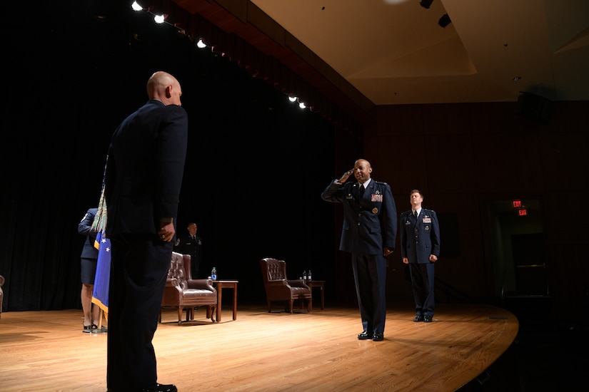 Col. Jaron H. Roux, (center), 437th Airlift Wing commander, salutes Maj. Gen. Sam C Barrett, 18th Air Force commander (left), at Joint Base Charleston, S.C. Aug. 7, 2020. The 437th AW deploys Airmen and aircraft worldwide in support of contingency operations that involve air-to-land and airdrop delivery of forces, equipment and supplies. These missions support combat operations, Joint Chiefs of Staff directed special operations missions and United States sponsored humanitarian relief efforts. (U.S. Air Force Photo by Senior Airman Joshua R. Maund)