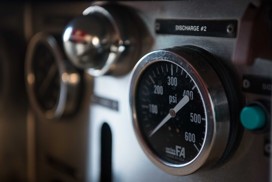 A pressure monitor is checked during a morning truck checkout Aug. 4, 2020, at McConnell Air Force Base, Kansas. The members of McConnell’s fire department are required to check all functions of the trucks to ensure they are working properly in case of emergencies. (U.S. Air Force photo by Senior Airman Alexi Bosarge)