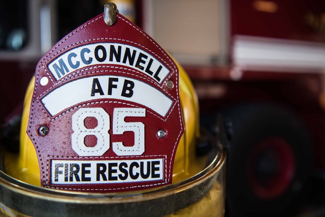 The helmet of a McConnell Air Force Base firefighter sits in Fire Station 1 Aug. 4, 2020, at McConnell AFB, Kansas. McConnell’s fire department team currently has 15 deployed members but is still able to fully support and continue to protect the installation from any emergency that comes their way. (U.S. Air Force photo by Senior Airman Alexi Bosarge)
