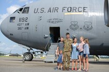 Col. Clinton ZumBrunnen, 437th Airlift Wing commander, and his family pose for a portrait after his fini flight as Airmen at Joint Base Charleston, S.C., Aug. 4, 2020. The fini flight is a military aviation tradition which marks a pilot’s retirement from the Air Force. ZumBrunnen Served in the U.S. Air Force for 22 years and accumulated more than 3,000 flight hours as an aviator. (U.S. Air Force Photo by Senior Airman Joshua R. Maund)