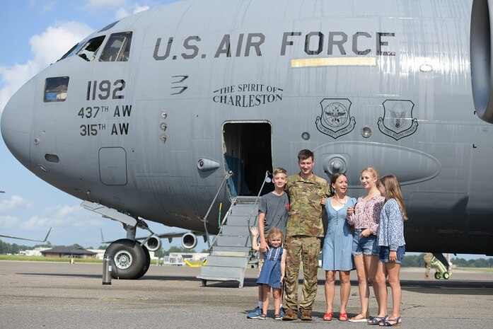Col. Clinton ZumBrunnen, 437th Airlift Wing commander, and his family pose for a portrait after his fini flight as Airmen at Joint Base Charleston, S.C., Aug. 4, 2020. The fini flight is a military aviation tradition which marks a pilot’s retirement from the Air Force. ZumBrunnen Served in the U.S. Air Force for 22 years and accumulated more than 3,000 flight hours as an aviator. (U.S. Air Force Photo by Senior Airman Joshua R. Maund)