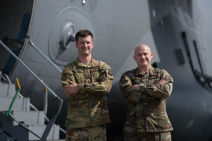 Col. Clinton ZumBrunnen, 437th Airlift Wing commander, left, and Command Chief Master Sgt. Ronnie Phillips, pose for a portrait after their fini flight at Joint Base Charleston, S.C., Aug. 4, 2020 ZumBrunnen Served in the U.S. Air Force for 22 years and accumulated over 3,000 flight hours as an aviator. (U.S. Air Force Photo by Senior Airman Joshua R. Maund)