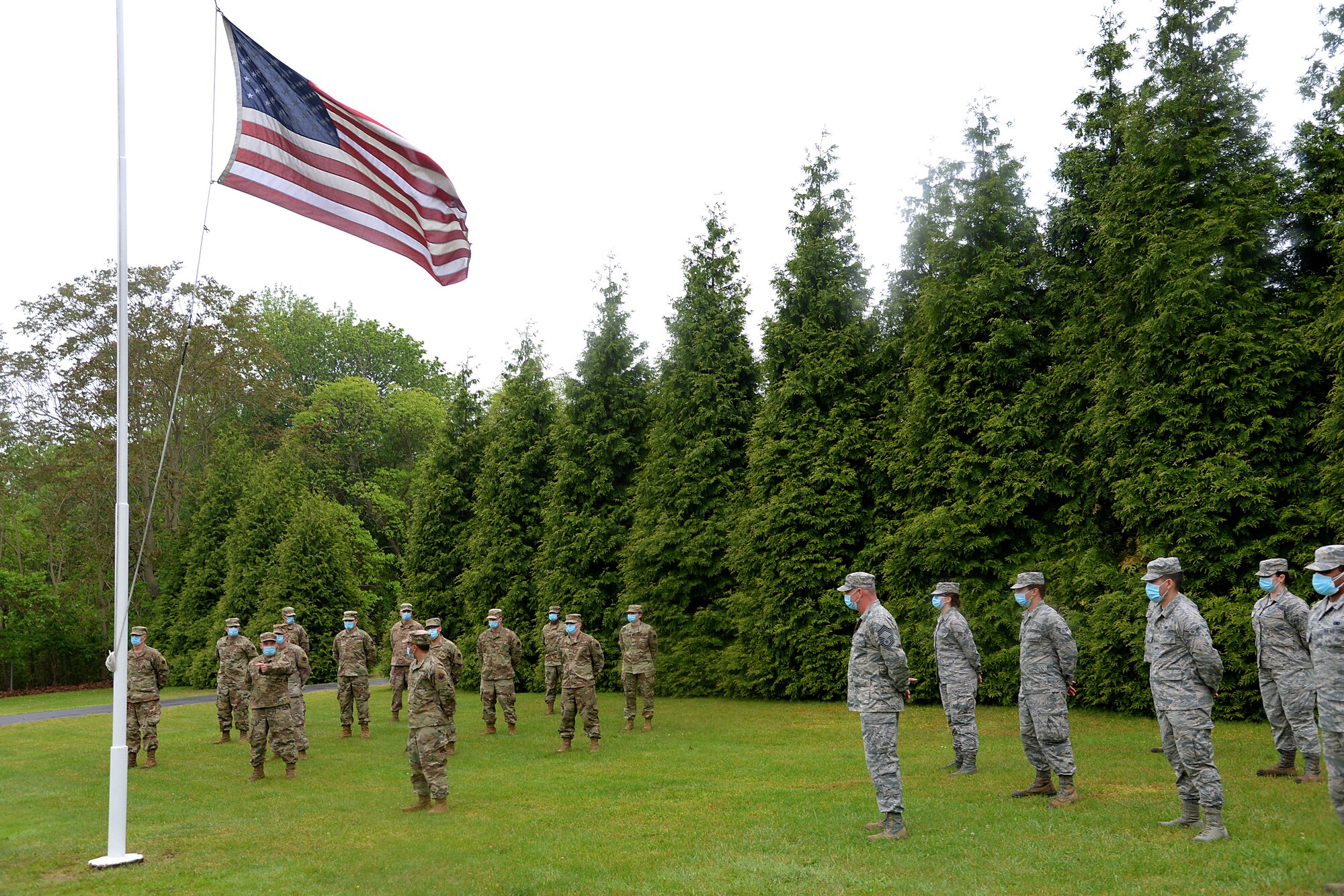 An image of members of the 177th Fighter Wing and 108th Wing, New Jersey Air National Guard, conducting a retreat ceremony May 22, 2020.