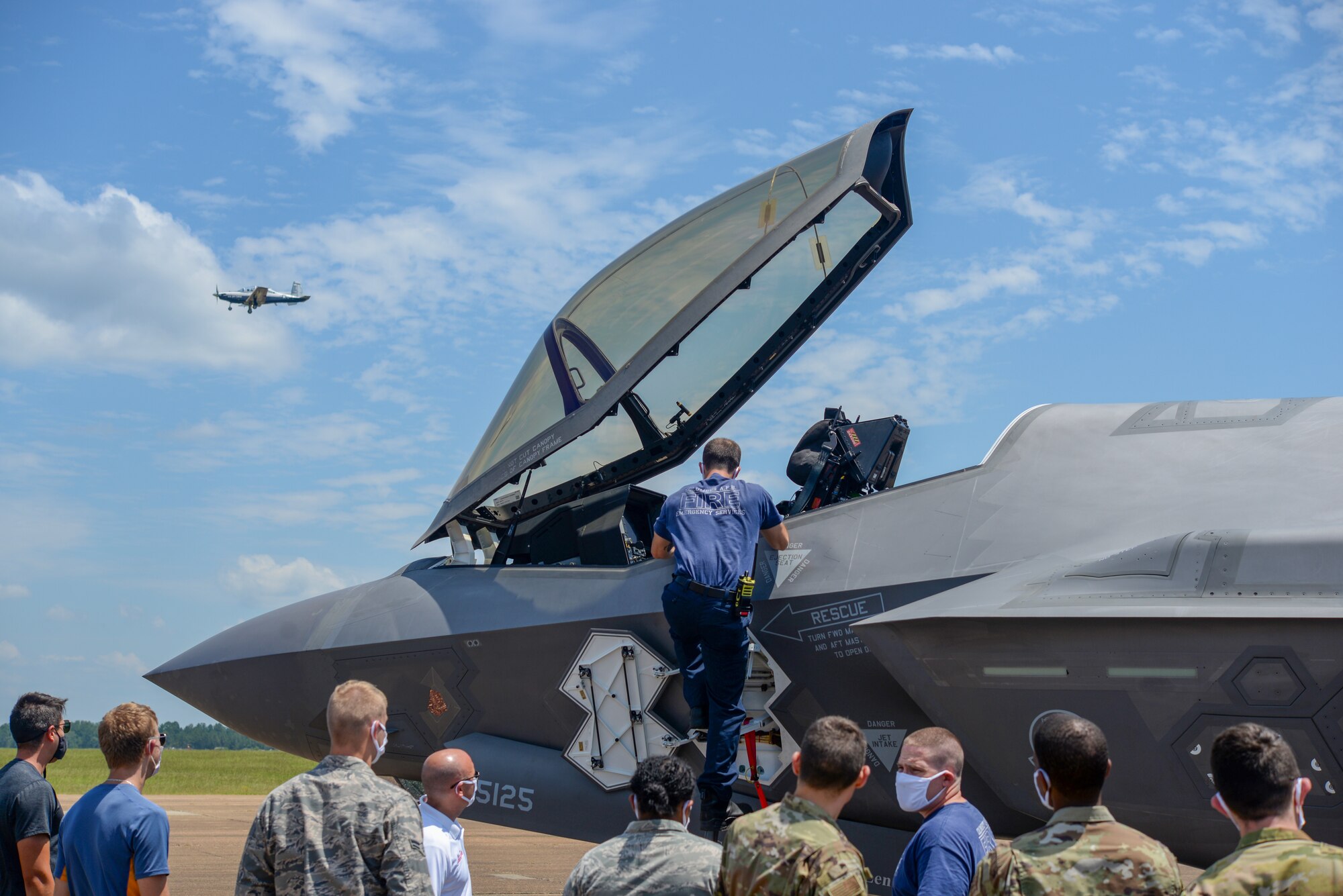 A member of the Columbus Air Force Base Fire Department looks at the interior of an F-35A Lighting II on August 7, 2020, at Columbus Air Force Base, Miss. The F-35 can reach a speed of up to 1, 200 mph. (U.S. Air Force photo by Airman 1st Class Davis Donaldson)
