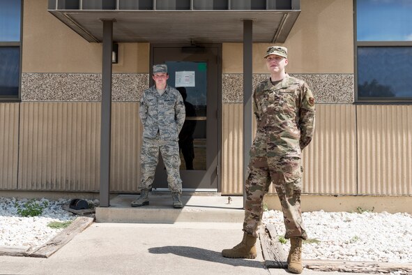 Senior Airman Christopher Beckett and Senior Airman Logan Sando, 47th Operations Support Squadron radar airfield and weather systems (RAWS) technicians, stand for a photo on August 7, 2020 at Laughlin Air Force Base, Texas. On June 26, 2020, as they drove from base to perform preventative maintenance the Next-Generation Weather Radar, they used their knowledge of Self-Aid Buddy-Care to save a family of six, who had wrecked. (U.S. Air Force photo by Senior Airman Anne McCready)
