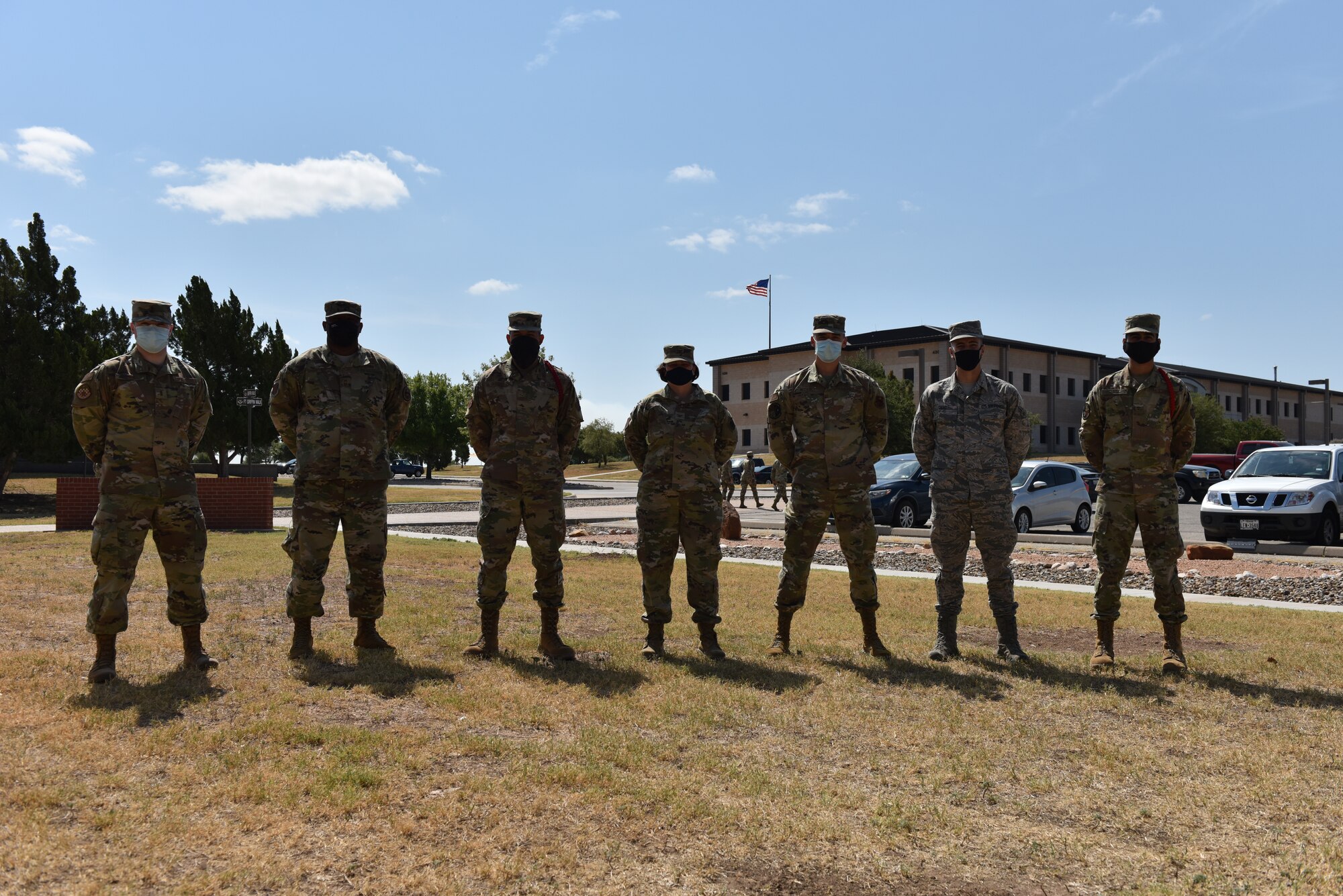 U.S. Air Force Col. Angelina Maguinness, 17th Training Group commander, and Chief Master Sgt. Charmane Tatum, 17th TRG superintendent, stand with the Student of the Month winners outside of Brandenburg Hall at Goodfellow, Texas, Aug. 7, 2020. The Student and Rope of the Month awards are given to those students who have distinguished themselves in courses and by leading others. (U.S. Air Force photo by Staff Sgt. Seraiah Wolf)