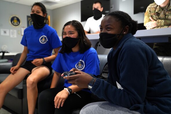 Students from the 81st Training Group play and watch video games in the Fishbowl gaming room inside the Levitow Training Support Facility at Keesler Air Force Base, Mississippi, Aug. 4, 2020. The 81st TRG put the gaming room together to give students the opportunity to interact and build friendships. (U.S. Air Force photo by Airman 1st Class Seth Haddix)