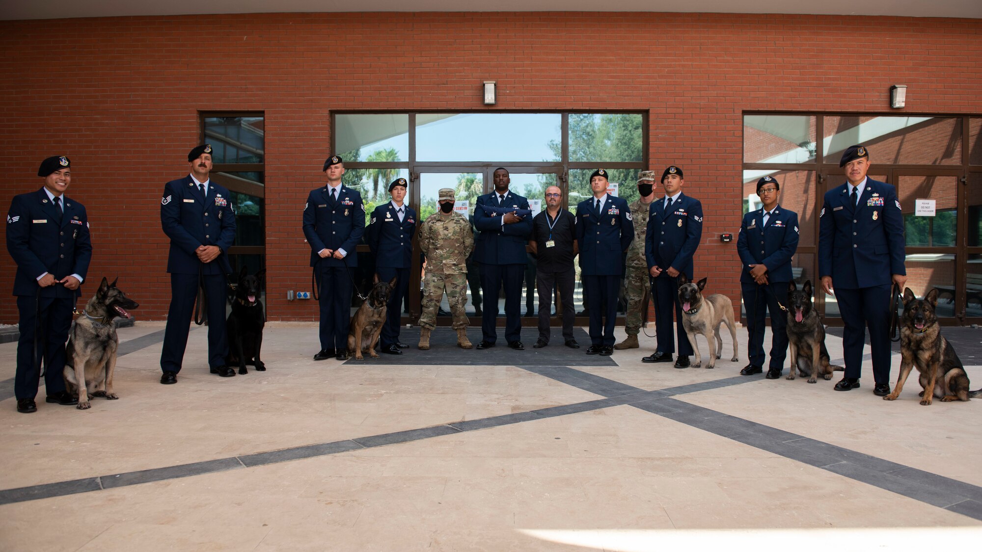 Airmen from the 39th Security Forces Squadron pose for a group photo after a memorial ceremony in honor of MWD Buck, Aug. 5, 2020, at Incirlik Air Base, Turkey
