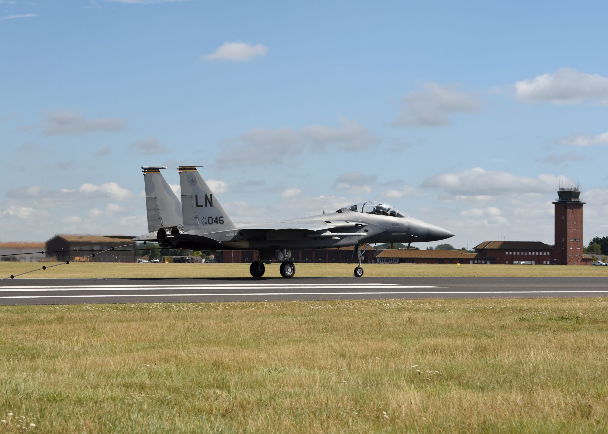An F-15E Strike Eagle assigned to the 48th Fighter Wing, RAF Lakenheath, engages a barrier during a certification test of the Mobile Aircraft Arresting System at RAF Mildenhall, England, Aug. 5, 2020. Airmen from the 100th Civil Engineer Squadron Power Production shop work with tail-hook-equipped aircraft to recertify the barrier cable annually, while performing maintenance checks 365 days a year. (U.S. Air Force photo by Karen Abeyasekere)