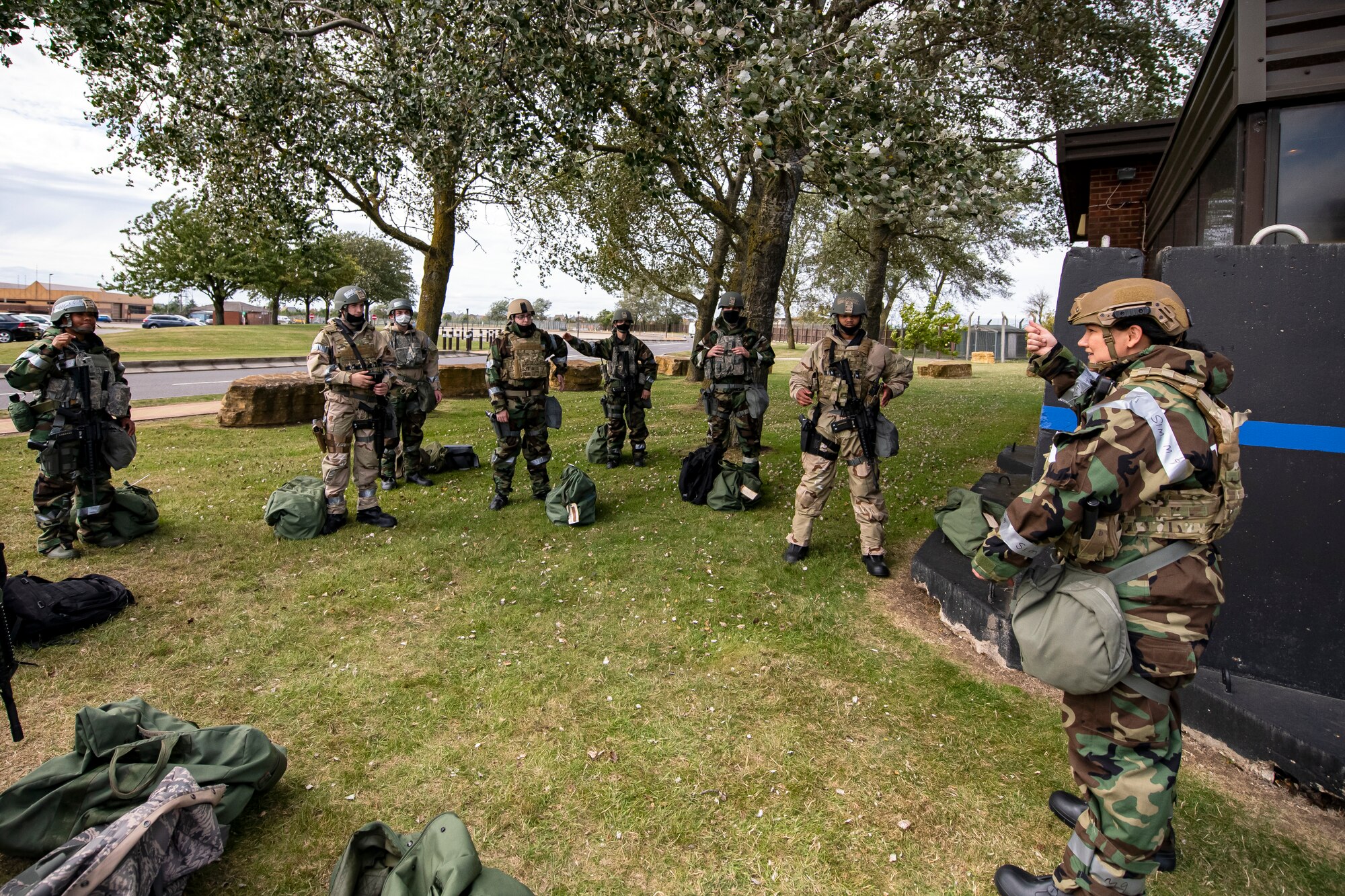 U.S. Air Force Master Sgt. Suzanna Donkor, 423rd Security Forces flight chief, briefs Airmen from the 501st Combat Support Wing (CSW) during a wing readiness exercise at RAF Alconbury, England, Aug. 5, 2020. The 501st CSW conducted the exercise to evaluate Airmen’s overall readiness along with their proficiency with responding to simulated chemical, biological, radiological, nuclear and explosive attacks. (U.S. Air Force photo by Senior Airman Eugene Oliver)