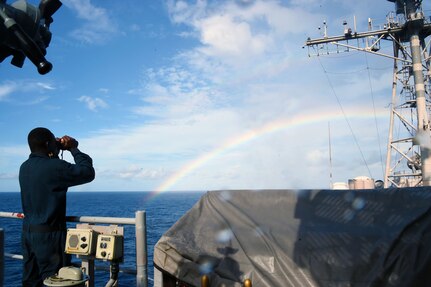 Seaman Desire Songzabre, from Bronx, New York, stands lookout watch after the rain aboard the Ticonderoga-class guided-missile cruiser USS  Philippine Sea (CG 58).