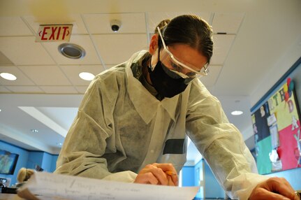 An image of U.S. Air Force Tech. Sgt. Veronika Sheldon, a Paralegal with the 177th Fighter Wing, New Jersey Air National Guard, quantifying personnel data at the New Jersey Veterans Memorial Home at Menlo Park in Edison, N.J.