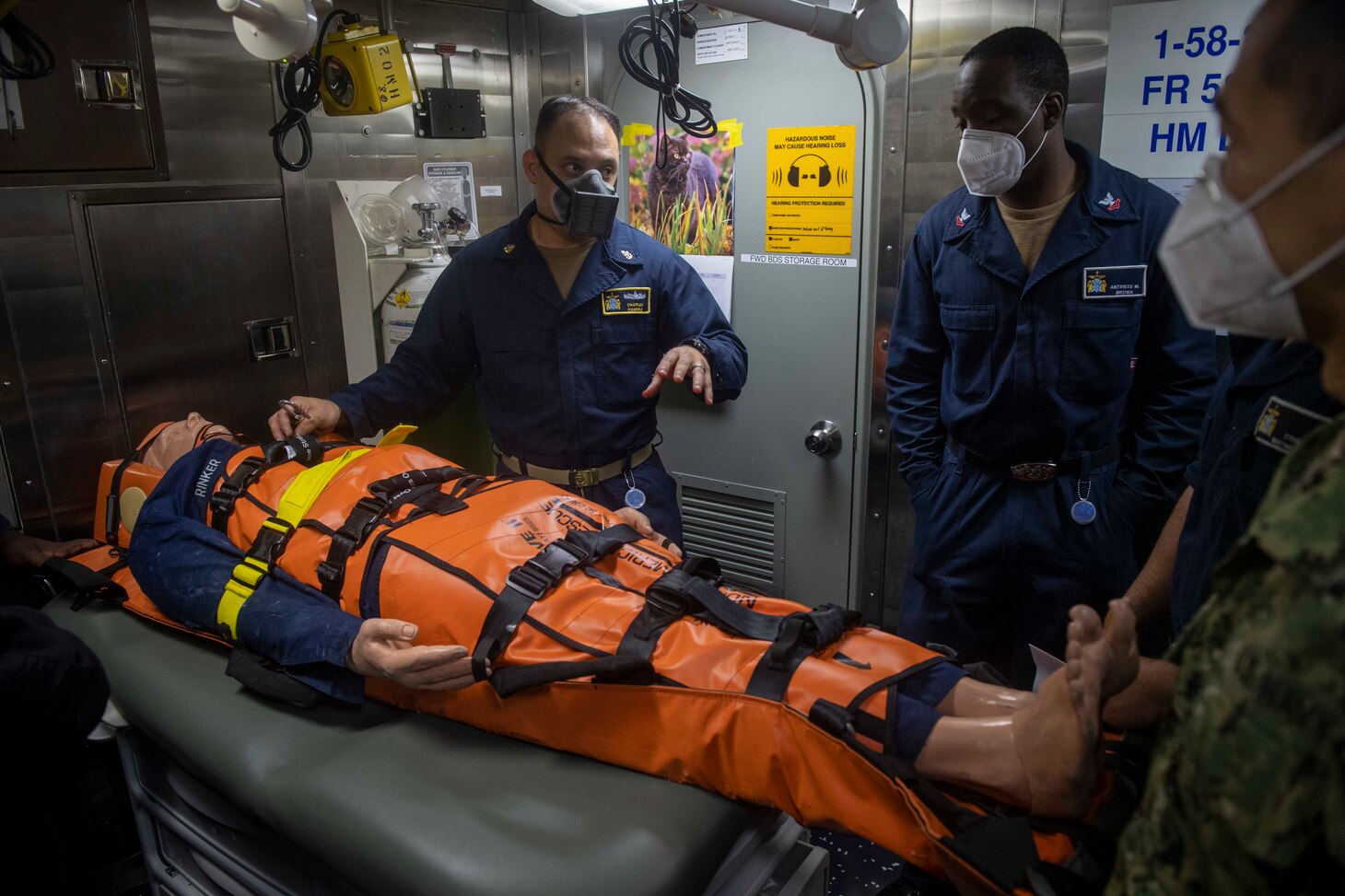 Hospital Corpsman Chief Charles Ramirez, from El Paso, Texas, leads stretcher bearer training aboard the Arleigh Burke-class guided-missile destroyer USS Thomas Hudner (DDG 116), Aug. 4, 2020.