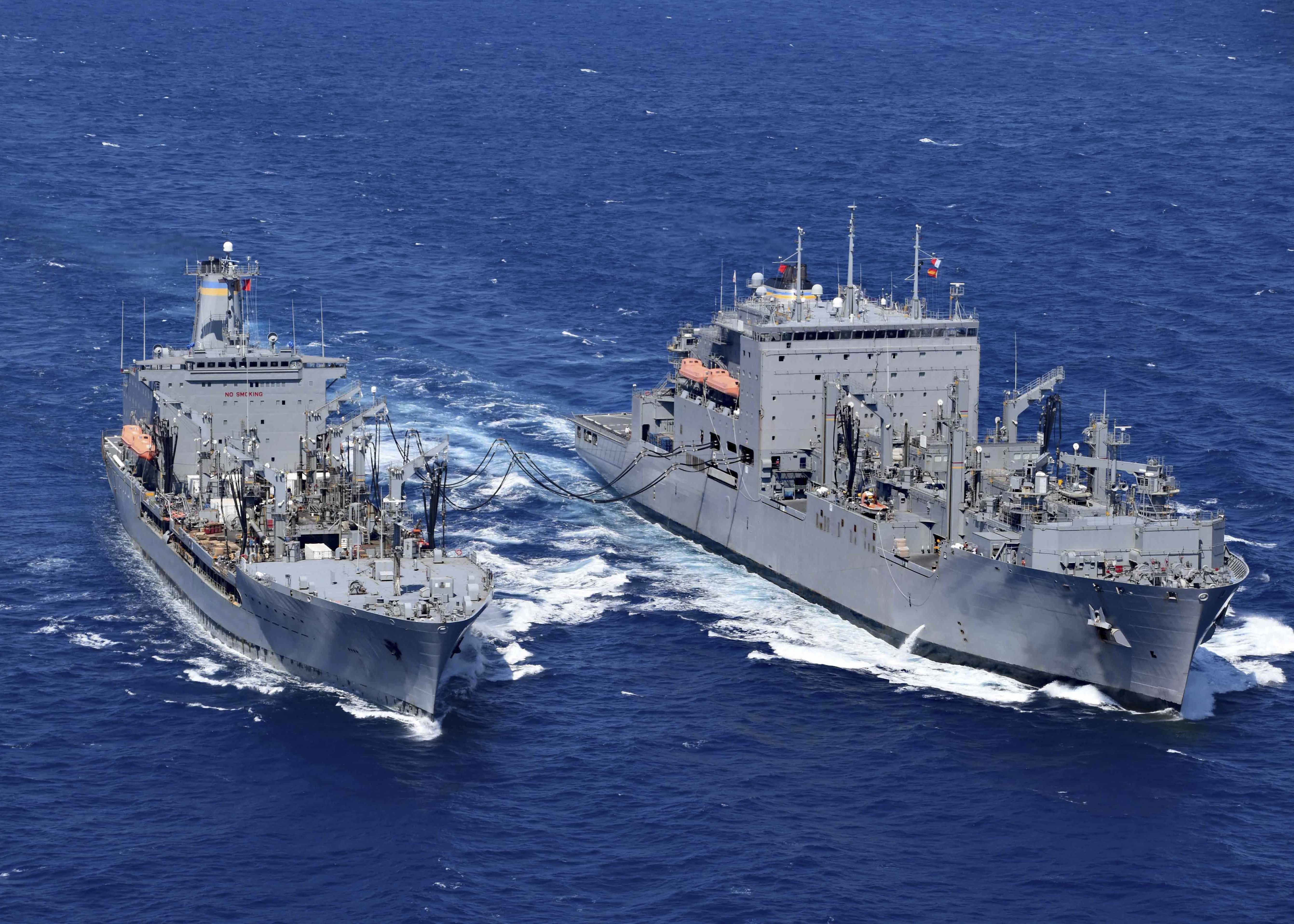 The Henry J. Kaiser-class fleet replenishment oiler USNS John Ericsson (T-AO 194), left, transfers fuel to the Lewis and Clark-class dry cargo and ammunition ship USNS Richard E. Byrd (T-AKE 4).