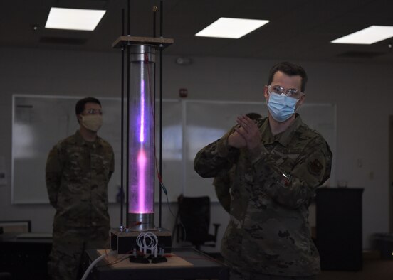 U.S. Air Force Tech. Sgt. David Hunt, 312th Training Squadron Special Instruments Training course instructor, explains different scientific concepts with a student-built plasma chamber, at the Louis F. Garland Department of Defense Fire Academy on Goodfellow Air Force Base, Texas, Aug. 5, 2020. Hunter demonstrated to the SPINSTRA students how volumetric pressure may affect electrons’ flow. (U.S. Air Force photo by Airman 1st Class Abbey Rieves)