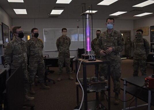 U.S. Air Force Tech. Sgt. David Hunt, 312th Training Squadron Special Instruments Training course instructor, fires up the plasma chamber, a visual teaching aid, for the SPINSTA students at the Louis F Garland Department of Defense Fire Academy on Goodfellow Air Force Base, Texas, Aug. 5, 2020. The plasma chamber was designed to demonstrate a variety of scientific, electronic and safety principles in a 10:1 student to instructor classroom ratio. (U.S. Air Force photo by Airman 1st Class Abbey Rieves)